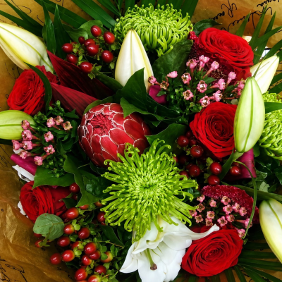 Luxury Romance - A luxury bouquet of Roses, lilies, blooms with a touch of the exotic, perfect for a loved one! Medium price shown.