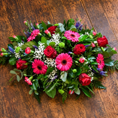 Funeral Tribute - A seasonal open spray in a choice of your colours, a perfect tribute to a loved one.